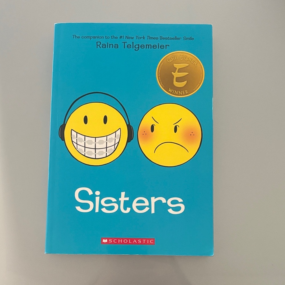 Scholastic Blue 'Sisters' Graphic Novel by Raina Telgemeier